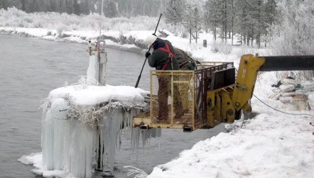 Drillers on a lift go to work on a well decommissioning job