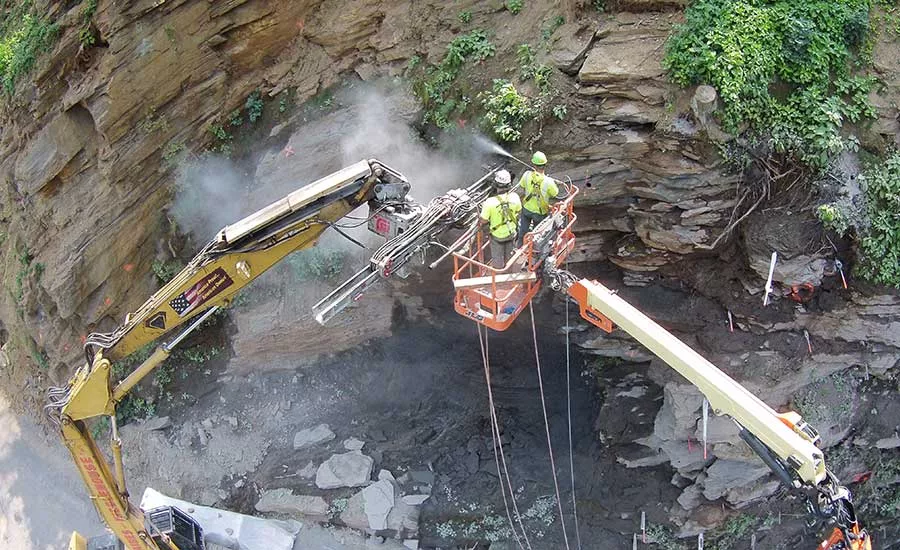 installing rock bolts in a cliff