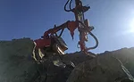 drilling rig on rock outcropping