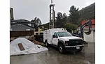 T4 drilling rig in small backyard