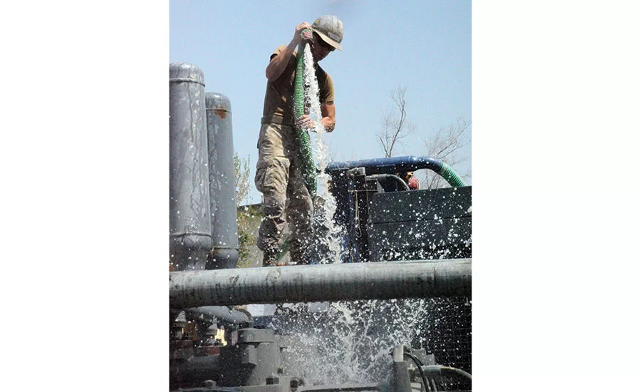 hosing down Mud Puppy filtration system