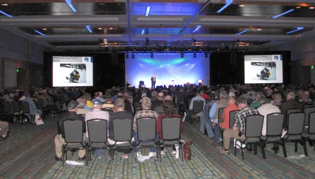 The crowd listens to Hanna's presentation.