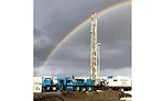 double rainbow over drilling rig