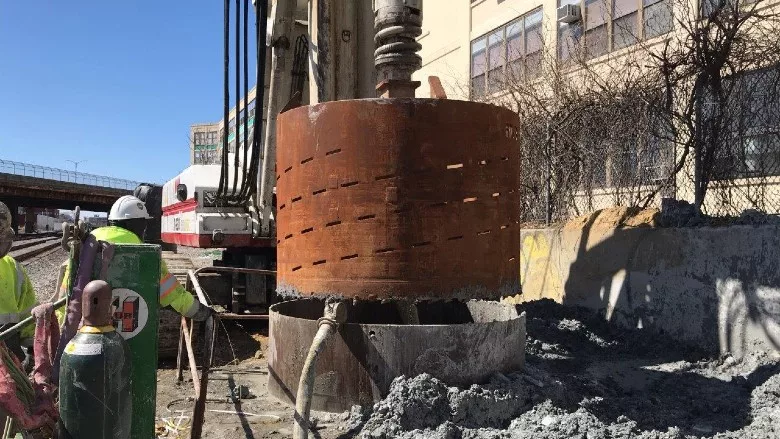 cleaning a drilled shaft on the Union Square Branch of the Green Line Extension project