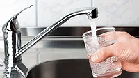drinkingwaterEPA.png a person pouring a glass of water.