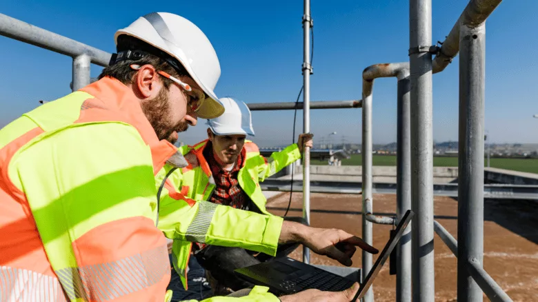 Workers working on a wastewater treatment system