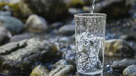 An image of a cup being filled up with water.