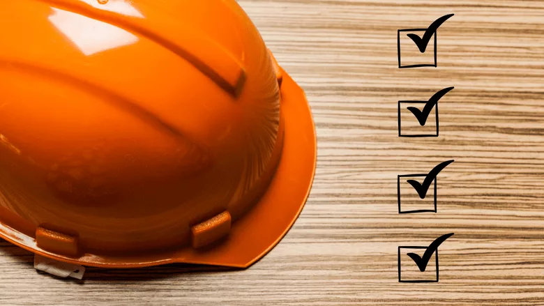 An image of a hardhat and a checklist