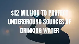 An image of someone drinking water in the background