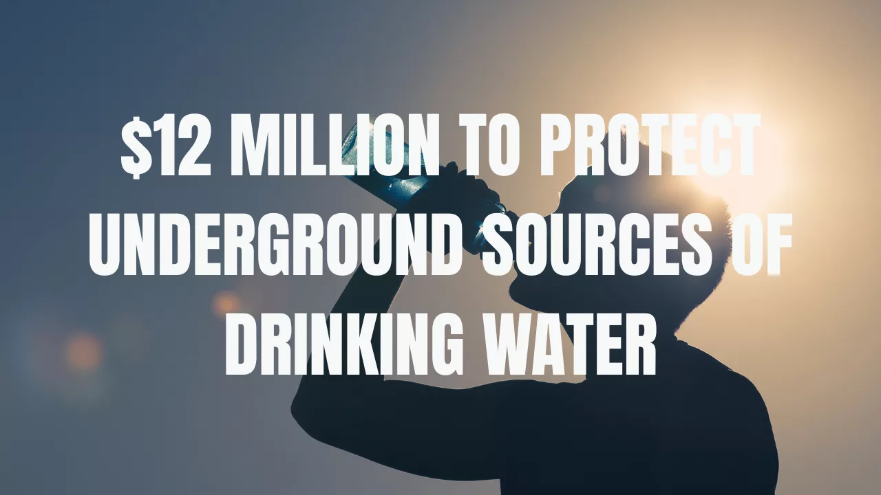 An image of someone drinking water in the background