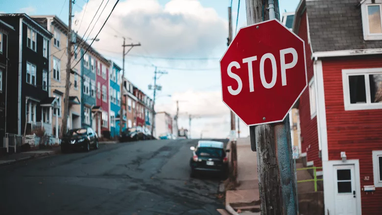 An image of a stop sign in a road