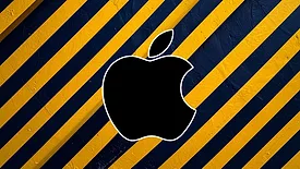 An image of Apple logo on hazard