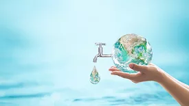 An image of the earth and a faucet