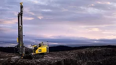 An image of a mining rig with an ominous background
