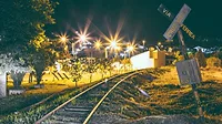 An image of a railroad at night