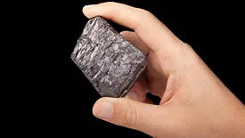  An image of someone holding graphite on a black background