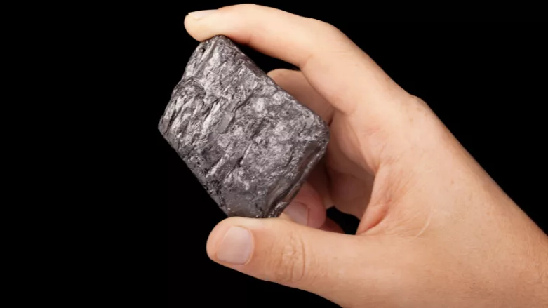  An image of someone holding graphite on a black background