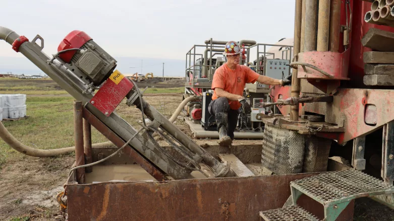 An image of driller Dave Bowers on a drill rig