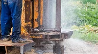 WaterWelldrilling3.png An image of a well being drilled and water spouting