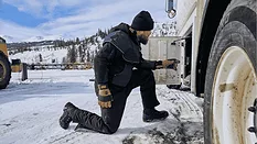 An image of a driller in a cold environment wearing warm gear.