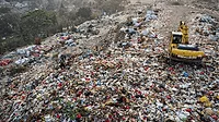 An image of a landfill at dawn