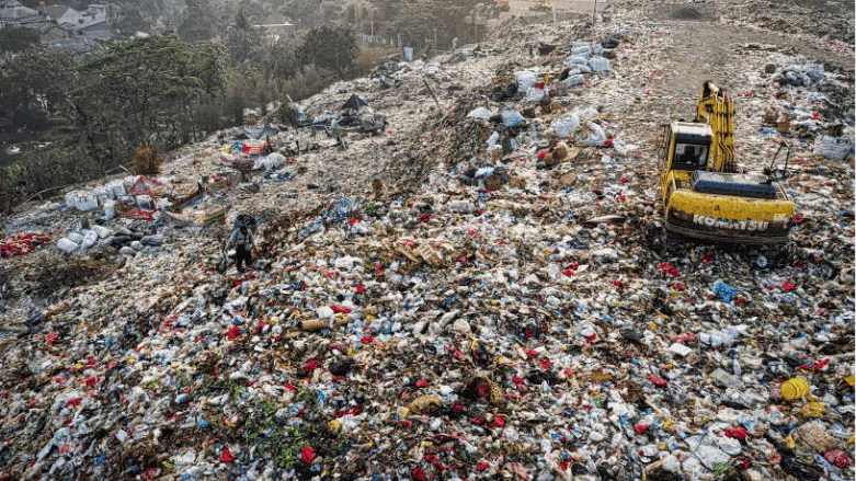 An image of a landfill at dawn