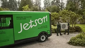 An image of a delivery van delivering a new heat pump