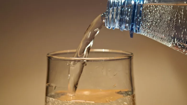 An image of someone pouring water
