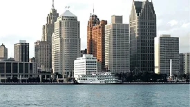 An image of the Detroit skyline with water in the forground