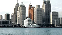 An image of the Detroit skyline with water in the forground