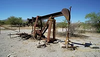 strange-happenings-MhM49uAV4mE-unsplash.jpg An old unused oil well
