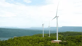 Wind Turbines spin in a field