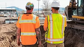 2 workers at a construction site