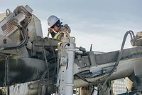 chandler-denise-bvhMsP6MrE8-unsplash.jpg Worker cleaning a rig
