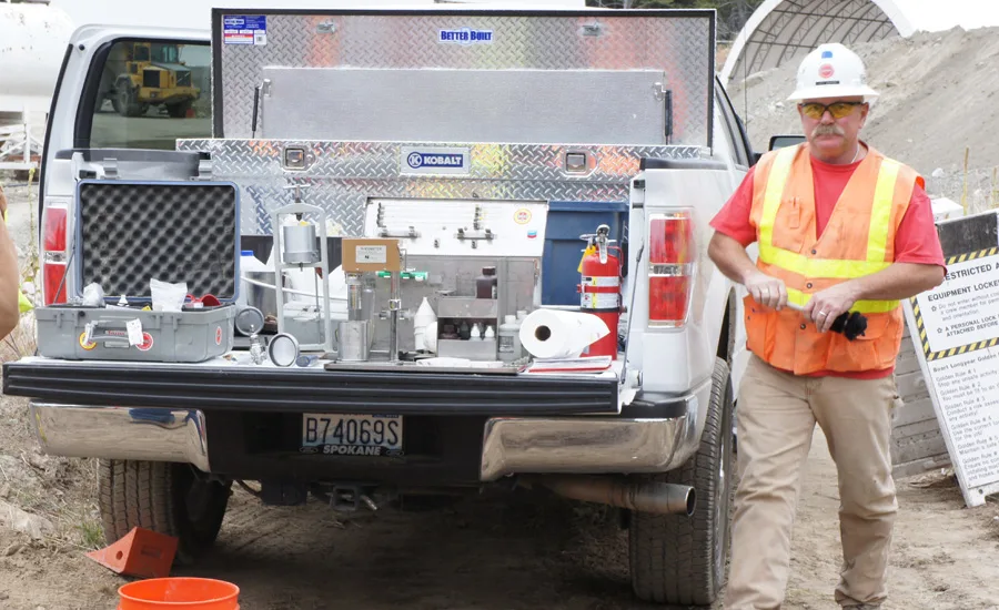 Jack Sowers with a collection of drilling fluids Mud Engineer Jack Sowers