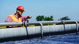 Man working on water piping systems