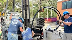 3 Drillers with a drilling rig