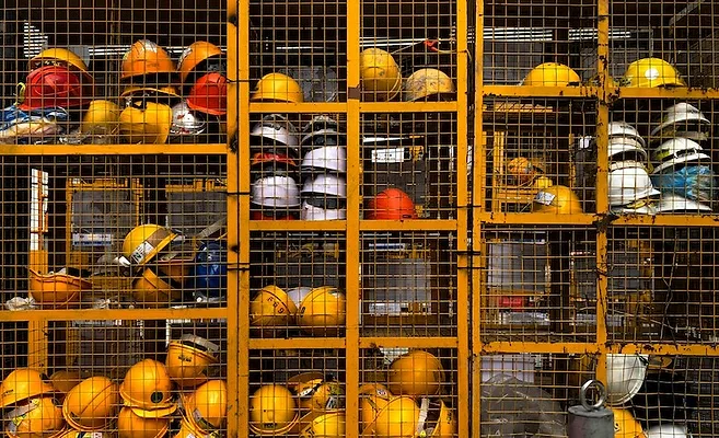 pop-zebra-wp81DxKUd1E-unsplash.jpg Hard hats in storage cage