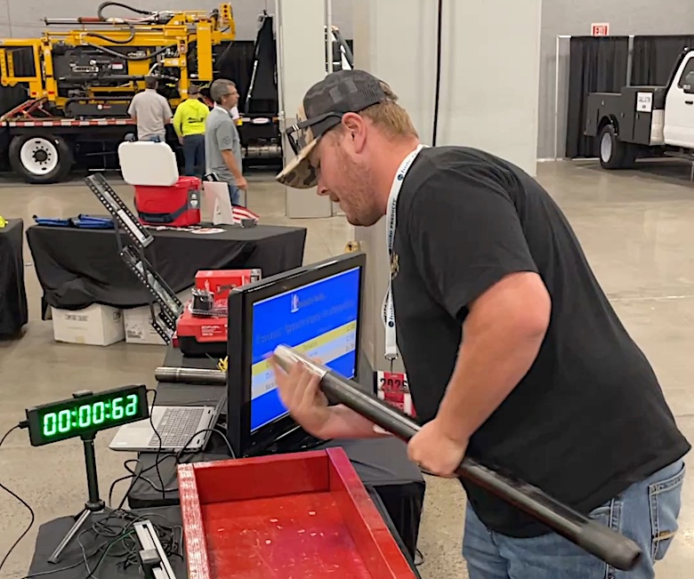 Driller testing how fast he can assemble a coring rod