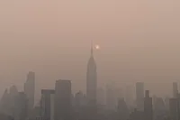 ahmer-kalam-Reuk1nmutFI-unsplash.jpg Wildfire smog envelopes a city