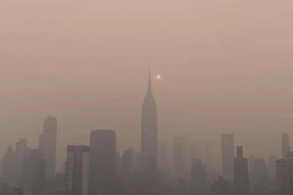 ahmer-kalam-Reuk1nmutFI-unsplash.jpg Wildfire smog envelopes a city