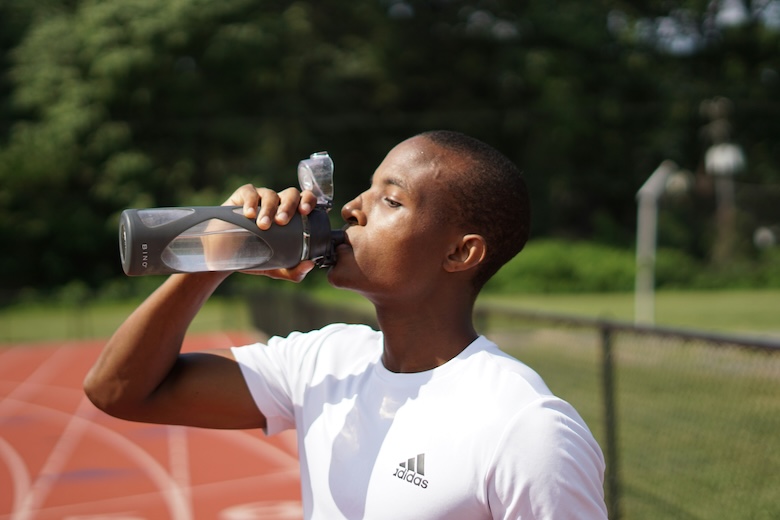 Runner drinking water