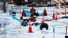 Thermal Energy Infrastructure A broken gas pipeline surrounded by traffic cones