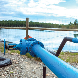 A containment pond holds water produced by fracking