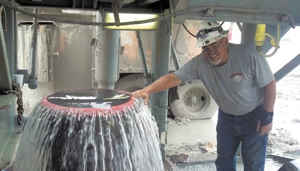 A Hydro worker shows off the flow of one of the High Head wells