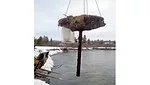 Crane lifts casing out of Madison river
