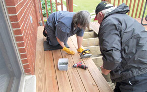 Linda and John Schmitt put in work on the family's deck