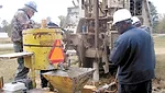 Employees of Sandersville Wells, drill at a site in Milledgeville, Ga.