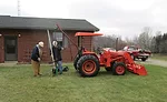 Tractor rigged with lifter pulls pipe