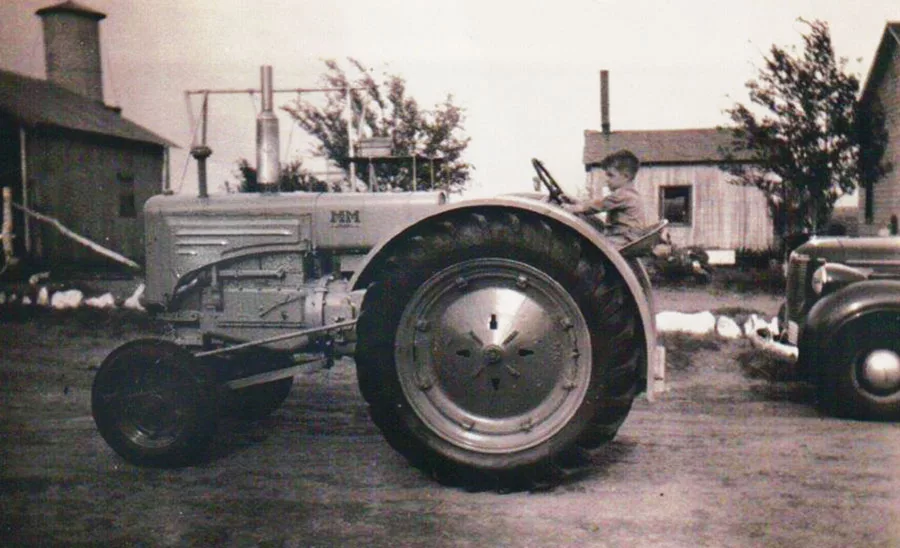 Young Porky on M&M tractor